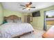 Large main bedroom features tile floors, green walls and a ceiling fan at 3057 Norlina St, Deltona, FL 32738