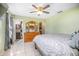 Large main bedroom features tile floors, green walls and a ceiling fan at 3057 Norlina St, Deltona, FL 32738