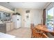 The kitchen features tile floors, stainless steel appliances and a white refrigerator at 3057 Norlina St, Deltona, FL 32738