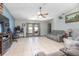 Bright living room with tile floors, neutral paint and a ceiling fan at 3057 Norlina St, Deltona, FL 32738