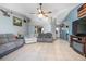Spacious living room with tile floors, neutral paint and a ceiling fan at 3057 Norlina St, Deltona, FL 32738