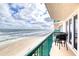 Balcony with oceanfront views and seating area at 3315 S Atlantic Ave # 705, Daytona Beach, FL 32118