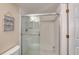 Clean bathroom featuring a shower with a glass door, tile flooring, and a fresh, modern design at 3315 S Atlantic Ave # 705, Daytona Beach, FL 32118