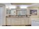 Bathroom boasts double vanity, granite counter, tub, and access to shower at 3315 S Atlantic Ave # 705, Daytona Beach, FL 32118