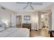 Relaxing bedroom with wooden floors, neutral colors, and a view to the bathroom at 3315 S Atlantic Ave # 705, Daytona Beach, FL 32118