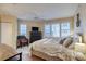 A bright bedroom with a coastal feel features hardwood floors and light, airy colors at 3315 S Atlantic Ave # 705, Daytona Beach, FL 32118