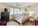 Bright bedroom with white furniture, wood floors, and beach-themed decor at 3315 S Atlantic Ave # 705, Daytona Beach, FL 32118