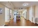 Open-concept kitchen and dining area with wood flooring, barstool seating, and updated appliances at 3315 S Atlantic Ave # 705, Daytona Beach, FL 32118
