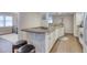 Kitchen view showcasing a granite countertop, breakfast bar, and modern appliances at 3315 S Atlantic Ave # 705, Daytona Beach, FL 32118