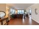 Bright living room boasting hardwood floors, comfortable seating, ocean views, and sliding glass door to a balcony at 3315 S Atlantic Ave # 705, Daytona Beach, FL 32118