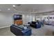Comfortable lounge area featuring couches, chairs and a large TV at 3315 S Atlantic Ave # 705, Daytona Beach, FL 32118
