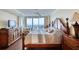 Comfortable main bedroom showcasing a decorative wood frame bed, ocean view, and dark wood floors at 3315 S Atlantic Ave # 705, Daytona Beach, FL 32118
