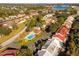 Expansive aerial view of the community featuring lush landscaping, a pool, and a serene lake at 3550 Forest Branch Dr # A, Port Orange, FL 32129