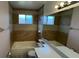 Neutral toned bathroom featuring a bathtub, shower, and tiled walls at 3550 Forest Branch Dr # A, Port Orange, FL 32129