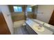 Neutral toned bathroom featuring a bathtub, shower, and tiled walls at 3550 Forest Branch Dr # A, Port Orange, FL 32129