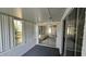 Covered patio with screened windows and sliding glass doors at 3550 Forest Branch Dr # A, Port Orange, FL 32129