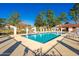 Community pool with lounge chairs at 3550 Forest Branch Dr # A, Port Orange, FL 32129