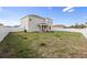 Spacious backyard with a partial lawn and privacy fence surrounding the perimeter at 3565 Fernanda Dr, Deltona, FL 32738