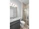 Modern bathroom featuring granite countertops, tile floors and glass enclosed shower at 3565 Fernanda Dr, Deltona, FL 32738