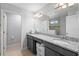Bathroom featuring granite countertops, dual sinks, and glass shower at 3565 Fernanda Dr, Deltona, FL 32738