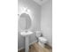 Bathroom with modern sink and toilet and tile floors at 3565 Fernanda Dr, Deltona, FL 32738