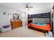 Spacious bedroom with a bunk bed, ceiling fan, and dresser for ample storage at 3565 Fernanda Dr, Deltona, FL 32738