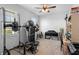 Bedroom with exercise equipment, natural light, ceiling fan, and desk at 3565 Fernanda Dr, Deltona, FL 32738
