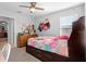 Bright bedroom features a ceiling fan and a large window providing natural light at 3565 Fernanda Dr, Deltona, FL 32738