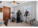 Bedroom with exercise equipment, natural light, ceiling fan, and desk at 3565 Fernanda Dr, Deltona, FL 32738