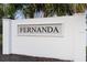 White community sign for Fernanda, surrounded by green trees at 3565 Fernanda Dr, Deltona, FL 32738