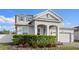 Charming two-story home with attractive landscaping, arched entry, and a two-car garage at 3565 Fernanda Dr, Deltona, FL 32738