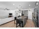 Spacious kitchen with a large island, stainless steel appliances, and stylish bar stools at 3565 Fernanda Dr, Deltona, FL 32738