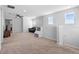 Spacious living room with neutral carpet, ceiling fan, and natural light at 3565 Fernanda Dr, Deltona, FL 32738