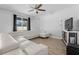 Spacious living room featuring a modern sectional sofa and tile floors at 3565 Fernanda Dr, Deltona, FL 32738