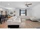Spacious living room and bright dining room with stylish sectional sofa and tile floors at 3565 Fernanda Dr, Deltona, FL 32738