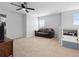 Comfortable living area with cozy couch, ceiling fan, and natural light at 3565 Fernanda Dr, Deltona, FL 32738