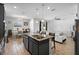 Bright living space with an open layout, connecting the modern kitchen and dining area at 3565 Fernanda Dr, Deltona, FL 32738