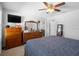 Spacious main bedroom featuring a ceiling fan, carpet flooring, and natural light at 3565 Fernanda Dr, Deltona, FL 32738