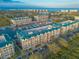 Stunning aerial view of the condominiums, marina, and ocean at 4626 Harbour Village Blvd # 3302, Ponce Inlet, FL 32127