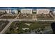 Aerial view of beachfront condominiums and beautiful landscaped grounds at 4626 Harbour Village Blvd # 3302, Ponce Inlet, FL 32127