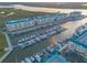 Beautiful aerial view of waterfront condominiums with boat docks at 4626 Harbour Village Blvd # 3302, Ponce Inlet, FL 32127