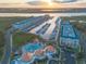 High angle view showcases waterfront condos, boat slips, pool, and clubhouse at 4626 Harbour Village Blvd # 3302, Ponce Inlet, FL 32127