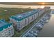 Gorgeous aerial view of waterfront condominiums with boat docks and river access at 4626 Harbour Village Blvd # 3302, Ponce Inlet, FL 32127