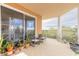 Open air balcony with views featuring a variety of potted plants and neutral tile flooring at 4626 Harbour Village Blvd # 3302, Ponce Inlet, FL 32127