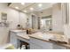 Bathroom featuring double sinks with white cabinetry and a large mirror with vanity lighting at 4626 Harbour Village Blvd # 3302, Ponce Inlet, FL 32127
