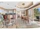 Cozy dining area with seating for six and access to an outdoor balcony at 4626 Harbour Village Blvd # 3302, Ponce Inlet, FL 32127