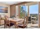 Inviting dining space with views and access to outdoor seating on the balcony at 4626 Harbour Village Blvd # 3302, Ponce Inlet, FL 32127