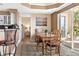 Comfortable dining room with seating for six and access to an outdoor balcony at 4626 Harbour Village Blvd # 3302, Ponce Inlet, FL 32127