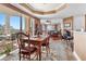 Inviting dining area adjacent to the living room with scenic views and ample natural light at 4626 Harbour Village Blvd # 3302, Ponce Inlet, FL 32127