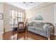 Comfortable living room with hardwood floors, cozy seating, and ample natural light at 4626 Harbour Village Blvd # 3302, Ponce Inlet, FL 32127